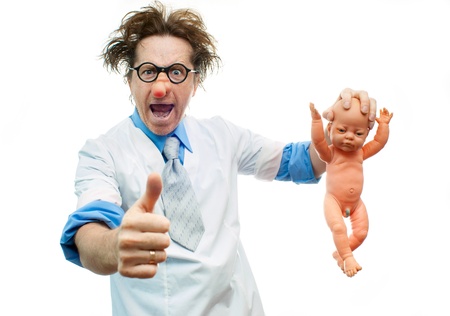 Crazy pediatrician holding a babyの写真素材