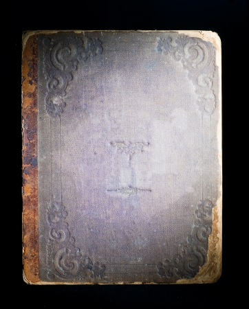 Cover of the old book on black backgroundの写真素材
