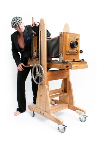 Funny creative photographer with retro cameraの写真素材