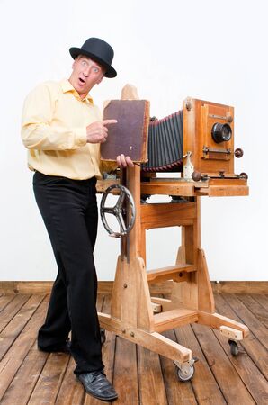 Creative professional photographer with photo camera and albumの写真素材