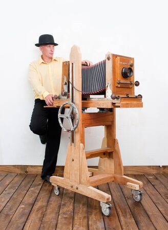 Meditative photographer with retro cameraの写真素材