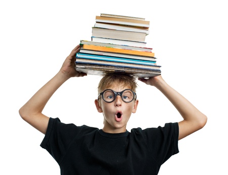 Astonishment schoolboy with books on her headの写真素材