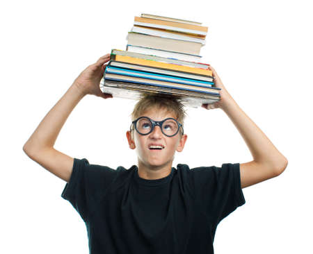 Tired schoolboy with books on her headの写真素材