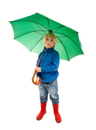Little boy with green umbrellaの写真素材