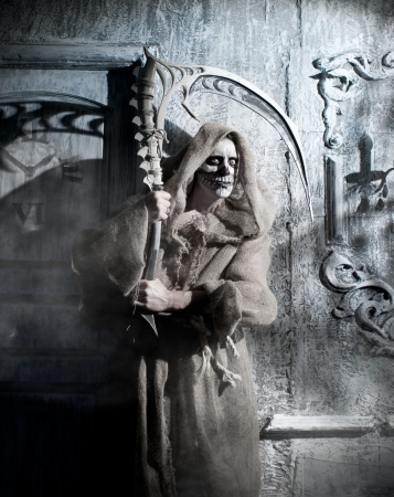 Death with a scythe on a holiday halloweenの写真素材