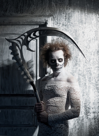 Scary ghost with a scythe in the old houseの写真素材