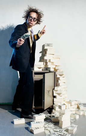 Crazy banker with bunch of moneyの写真素材