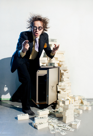 Crazy banker with bunch of moneyの写真素材