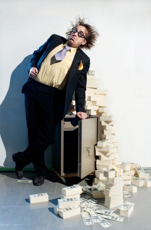 Crazy banker with bunch of moneyの写真素材