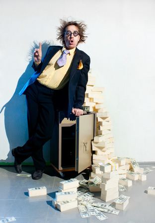 Crazy banker with bunch of moneyの写真素材