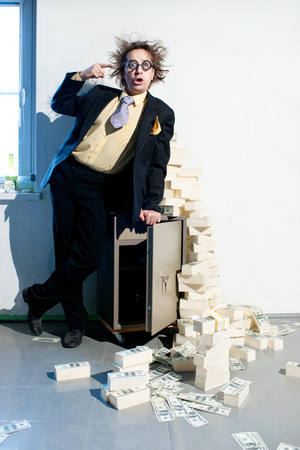 Crazy banker with bunch of moneyの写真素材