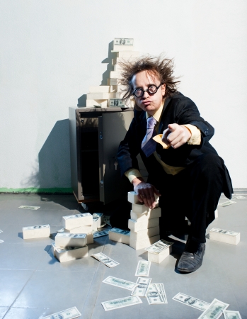 Crazy banker with bunch of moneyの写真素材