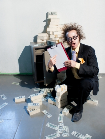 Crazy banker with bunch of money の写真素材