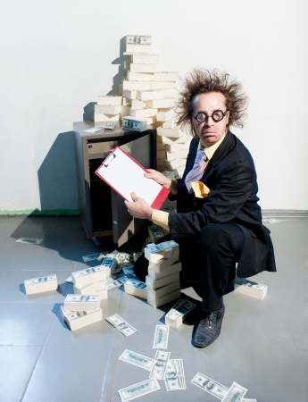 Crazy banker with bunch of moneyの写真素材