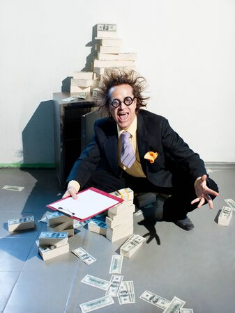 Crazy banker with bunch of moneyの写真素材