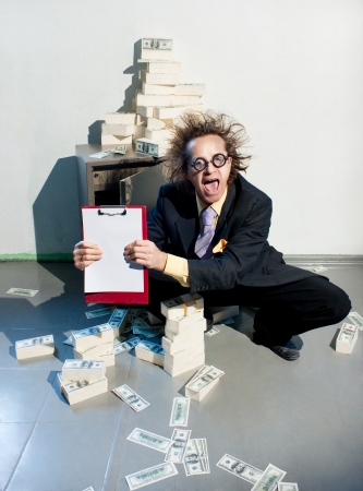 Crazy banker with bunch of moneyの写真素材