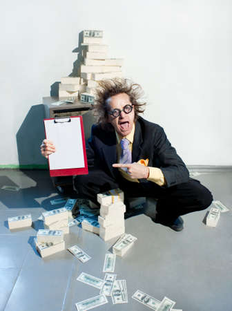 Crazy banker with bunch of moneyの写真素材