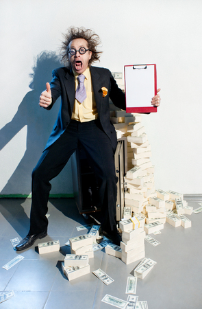 Crazy banker with bunch of moneyの写真素材