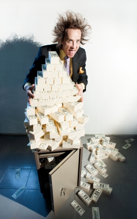 Greedy banker with bunch of moneyの写真素材