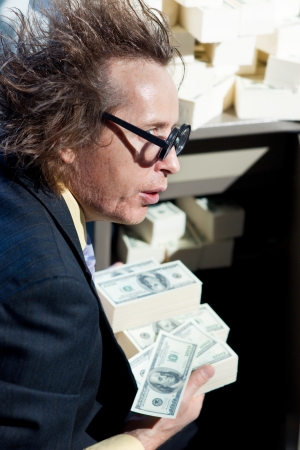 Greedy banker with bunch of moneyの写真素材