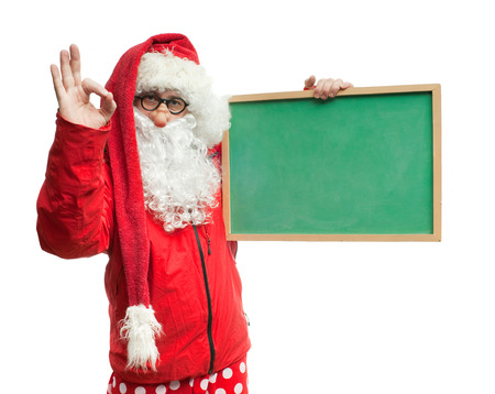 Funny Santa Claus in a red blazer with a blackboardの写真素材