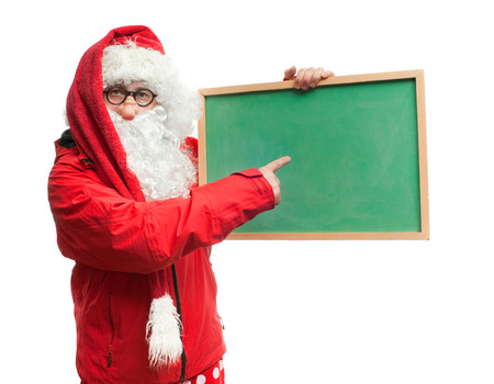 Funny Santa Claus in a red blazer with a blackboardの写真素材