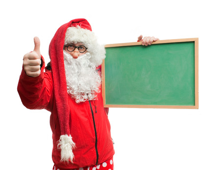 Funny Santa Claus in a red blazer with a blackboardの写真素材