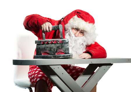Santa Claus with the iron and ironing boardの写真素材