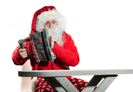 Santa Claus with the iron and ironing boardの写真素材