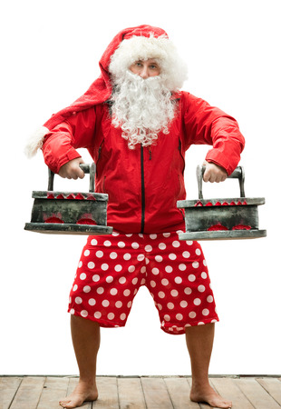 Santa Claus is athlete with the ironsの写真素材