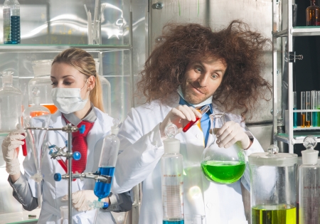 Crazy chemists conduct a scientific experiment in a laboratoryの写真素材
