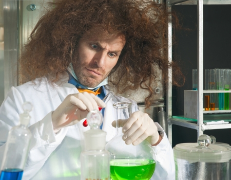 Bizarre chemists conduct a scientific experiment in a laboratoryの写真素材
