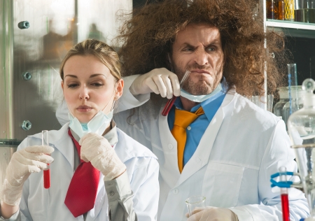 Crazy chemists conduct a scientific experiment in a laboratoryの写真素材