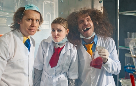Bizarre chemists a preparing a scientific experiment in a laboratoryの写真素材