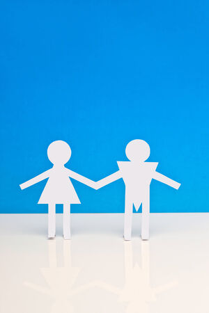 Figures of man and woman on a blue backgroundの写真素材