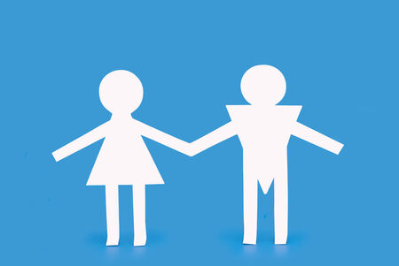Figures of man and woman on a blue backgroundの写真素材