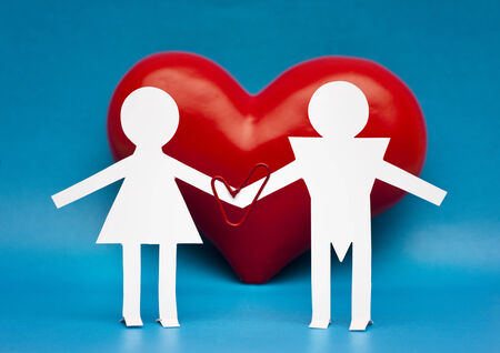 Figures of man and woman on a background of heartの写真素材