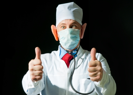 Crazy doctor wearing a mask from the flu with big earsの写真素材