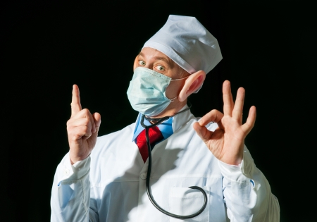 Crazy doctor wearing a mask from the flu with big earsの写真素材