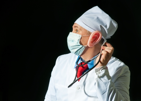 Crazy doctor wearing a mask from the flu with big earの写真素材