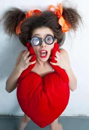 Funny girl with a red heartの写真素材