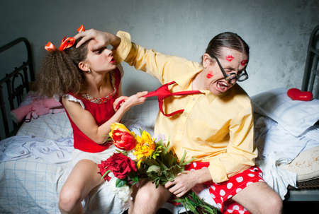 Quarrel of spouses on the bedの写真素材
