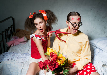 Passionate couple sitting on the bedの写真素材