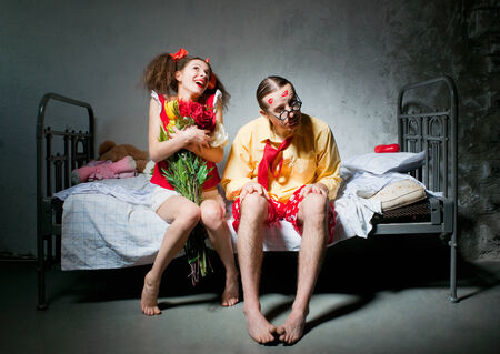 Loving couple sitting on the bedの写真素材