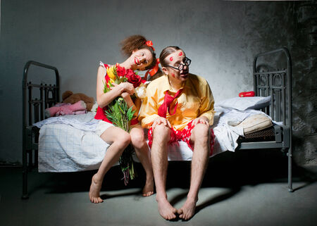 Loving couple sitting on the bedの写真素材