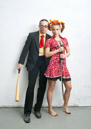 Man and woman stands near a wallの写真素材