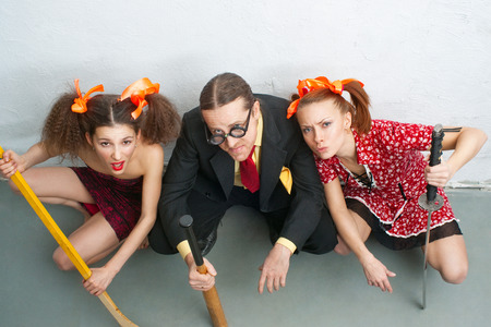 Aggressive man and women sitting on the floorの写真素材
