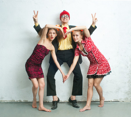 Cheerful man with two charming girlfriendsの写真素材
