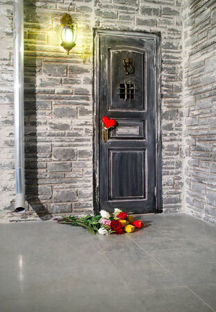 Wall of the house with a door in the foregroundの写真素材