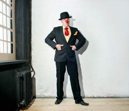 Actor in a black suit in the room with window の写真素材